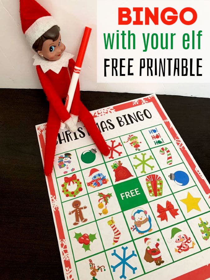 elf on the shelf with christmas bingo sheet holding marker