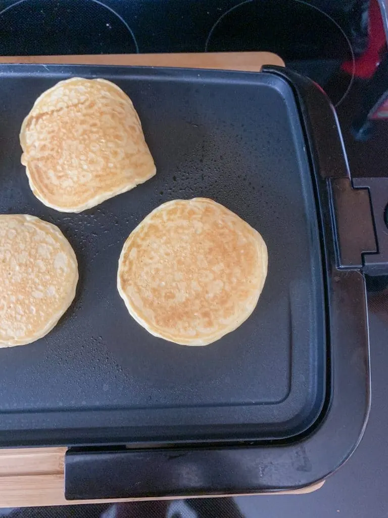 golden brown pancakes on electric griddle